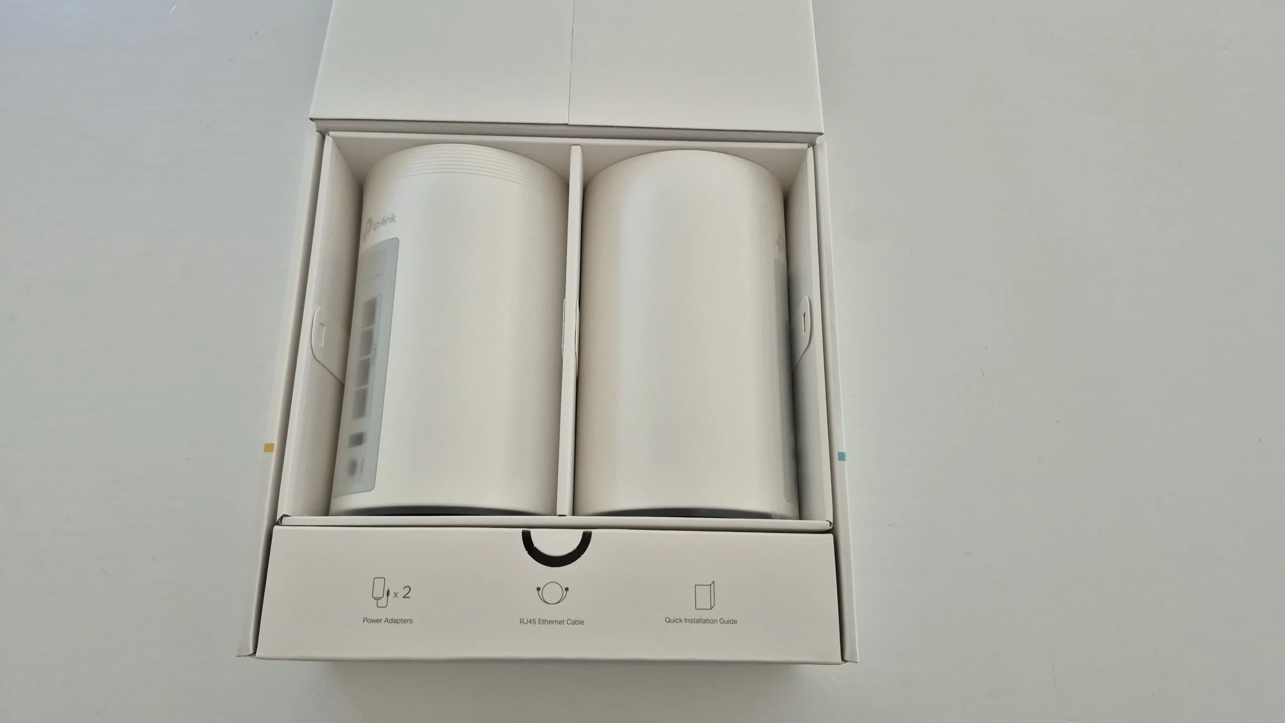 Opening the box reveals the two Deco units and accessory compartments.